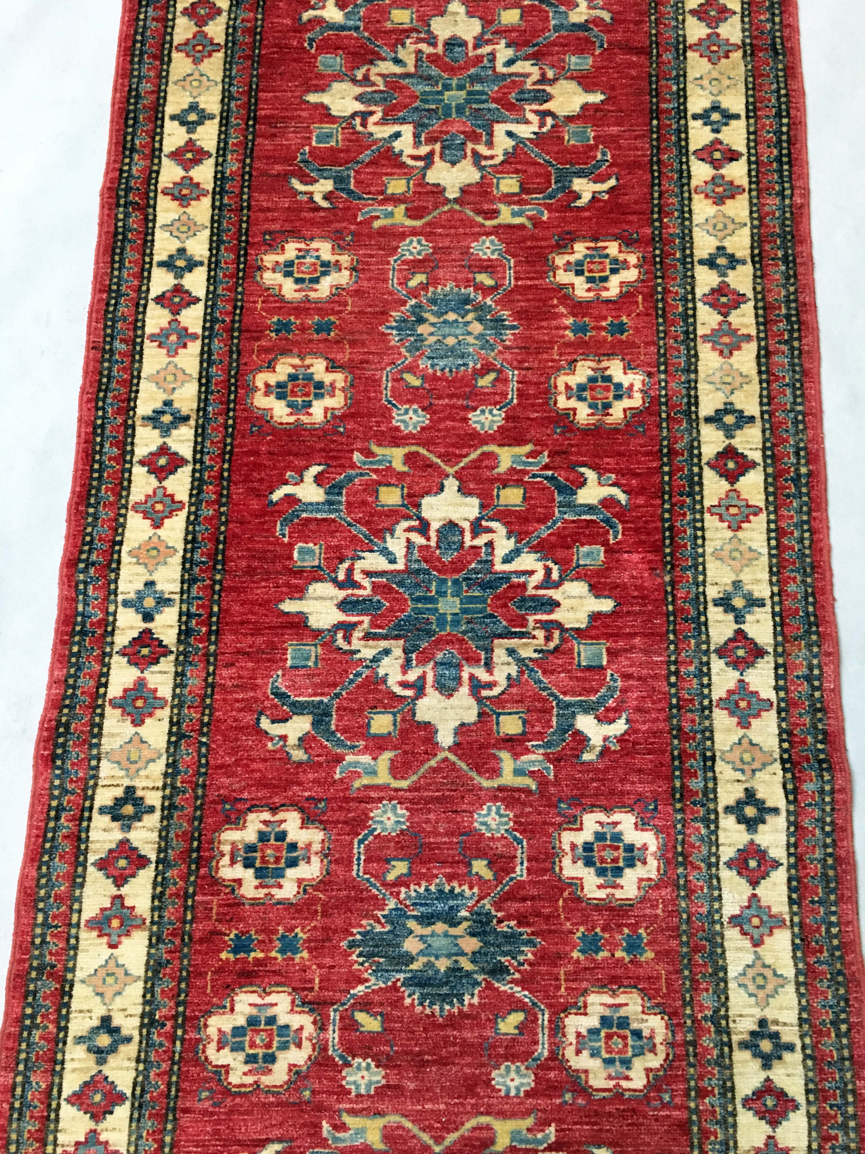 Remarkable oriental rug: former Kazak 310 x 84 cm