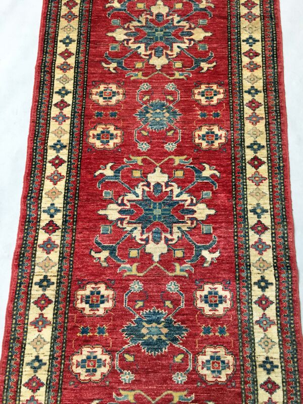 Remarquable tapis d'Orient: Kazak ancien 310x84 cm