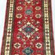Remarkable oriental rug: former Kazak 310 x 84 cm