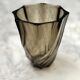 Small translucent dark brown twisted glass vase