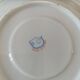 Trio of floral porcelain cups and saucers