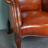Old armchair in sheep leather