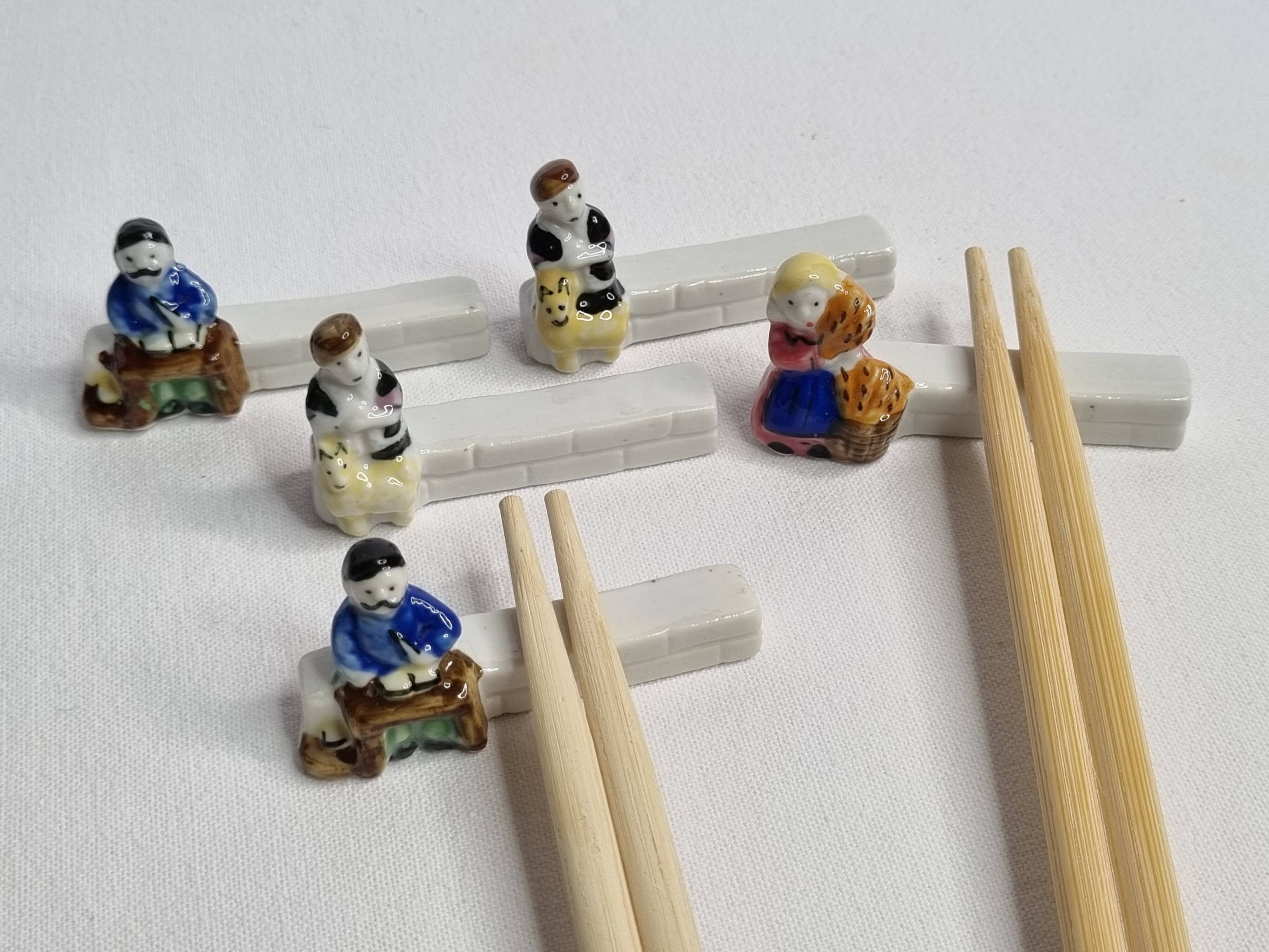 Five porcelain knife holders signed "Le Merzer", 6 cm