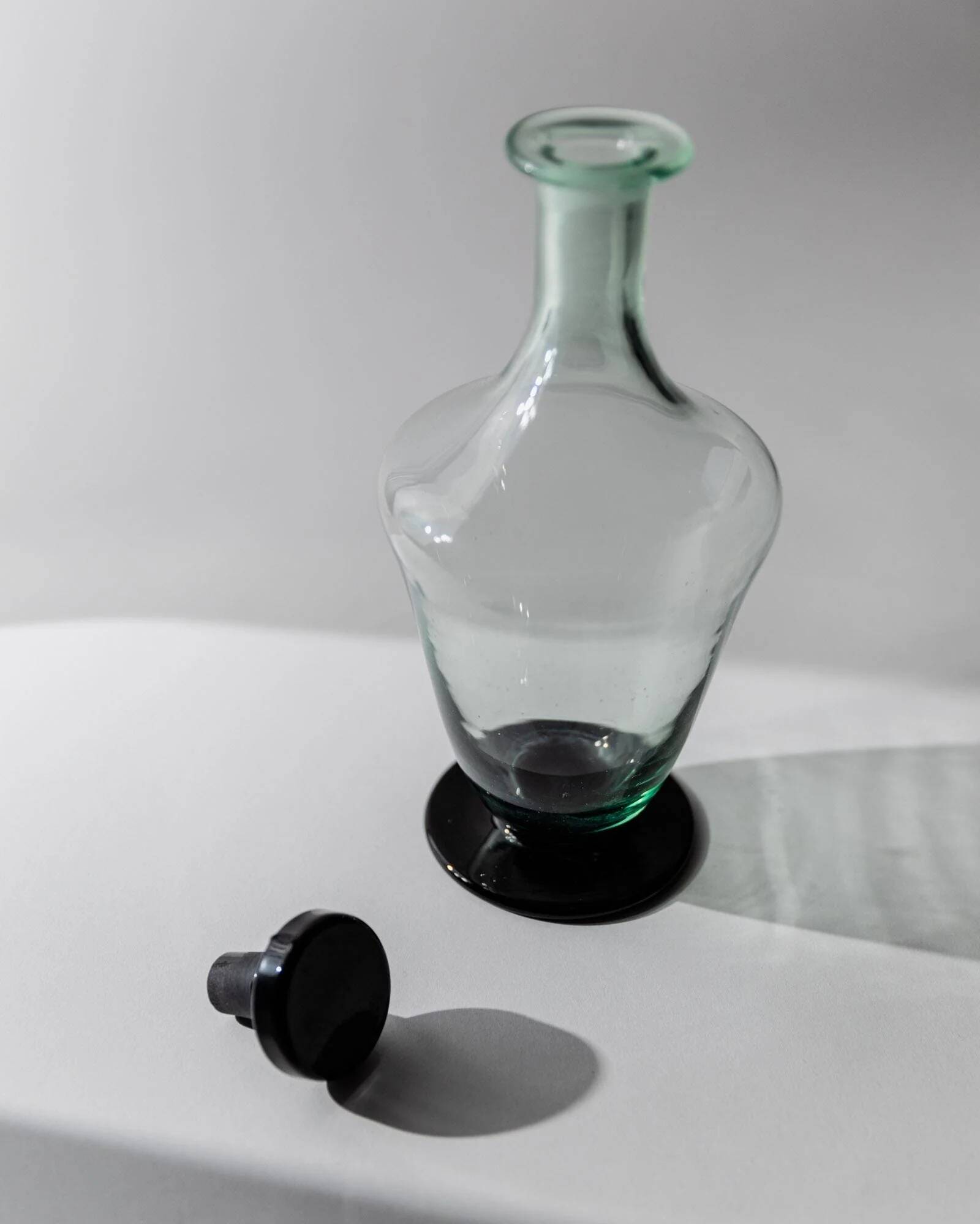 Vintage Murano glass carafe from the 1960s, green and black, with a stopper.