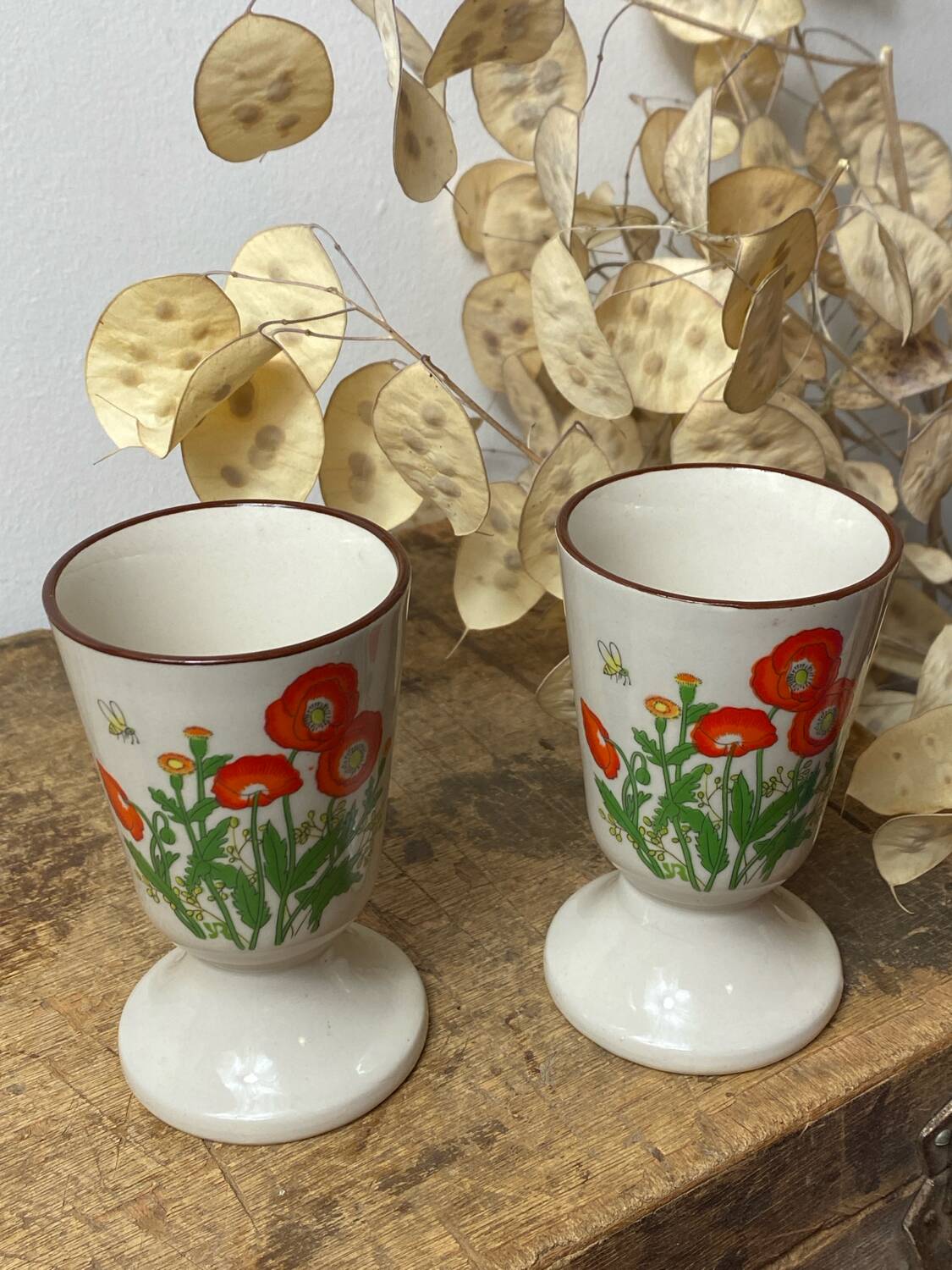 Pair of stoneware mazagrans, poppy decoration