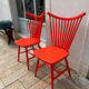 Pair of vintage red Scandinavian IKEA chairs.