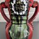 Red vase with floral decoration