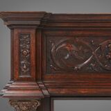 Richly decorated antique fireplace in oak, Belgium ca. 1920