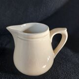 Old milk jug in steel clay