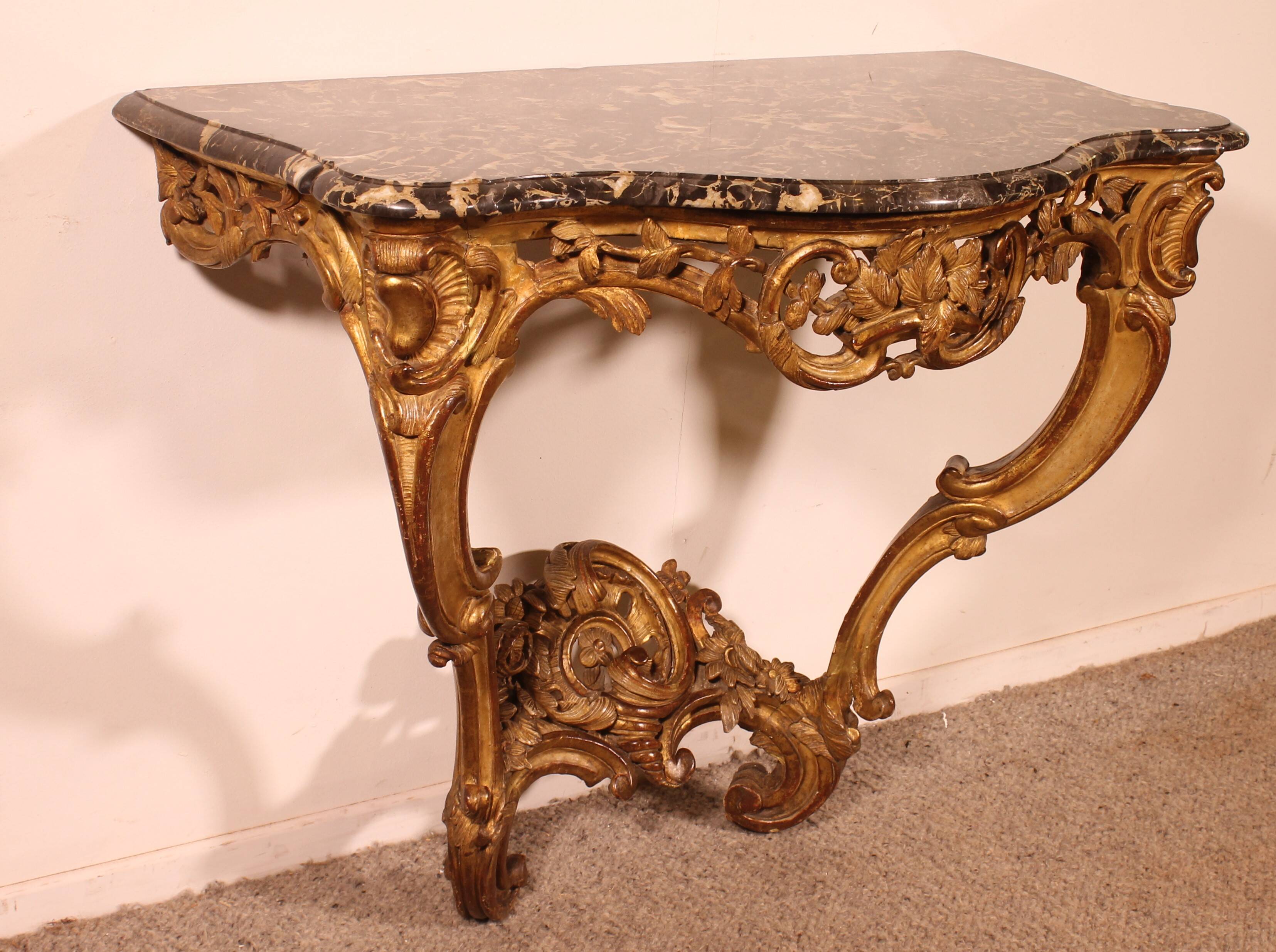Louis XV period console in gilded wood