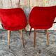Paire de chaises Achille Decommere en fausse fourrure rouge et pieds compas en bois