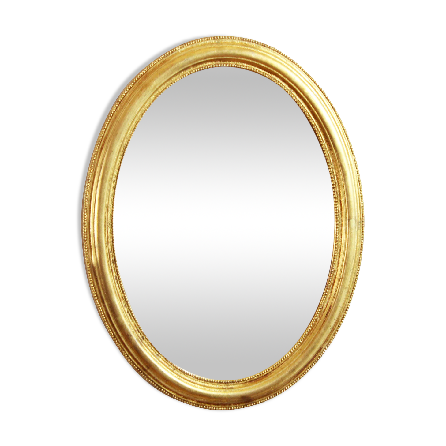 Golden oval mirror with leaf