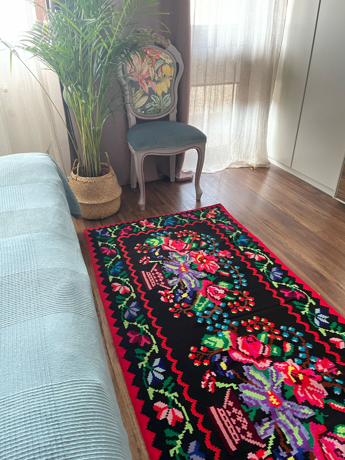 Vintage Romanian handwoven carpet with floral colorful design