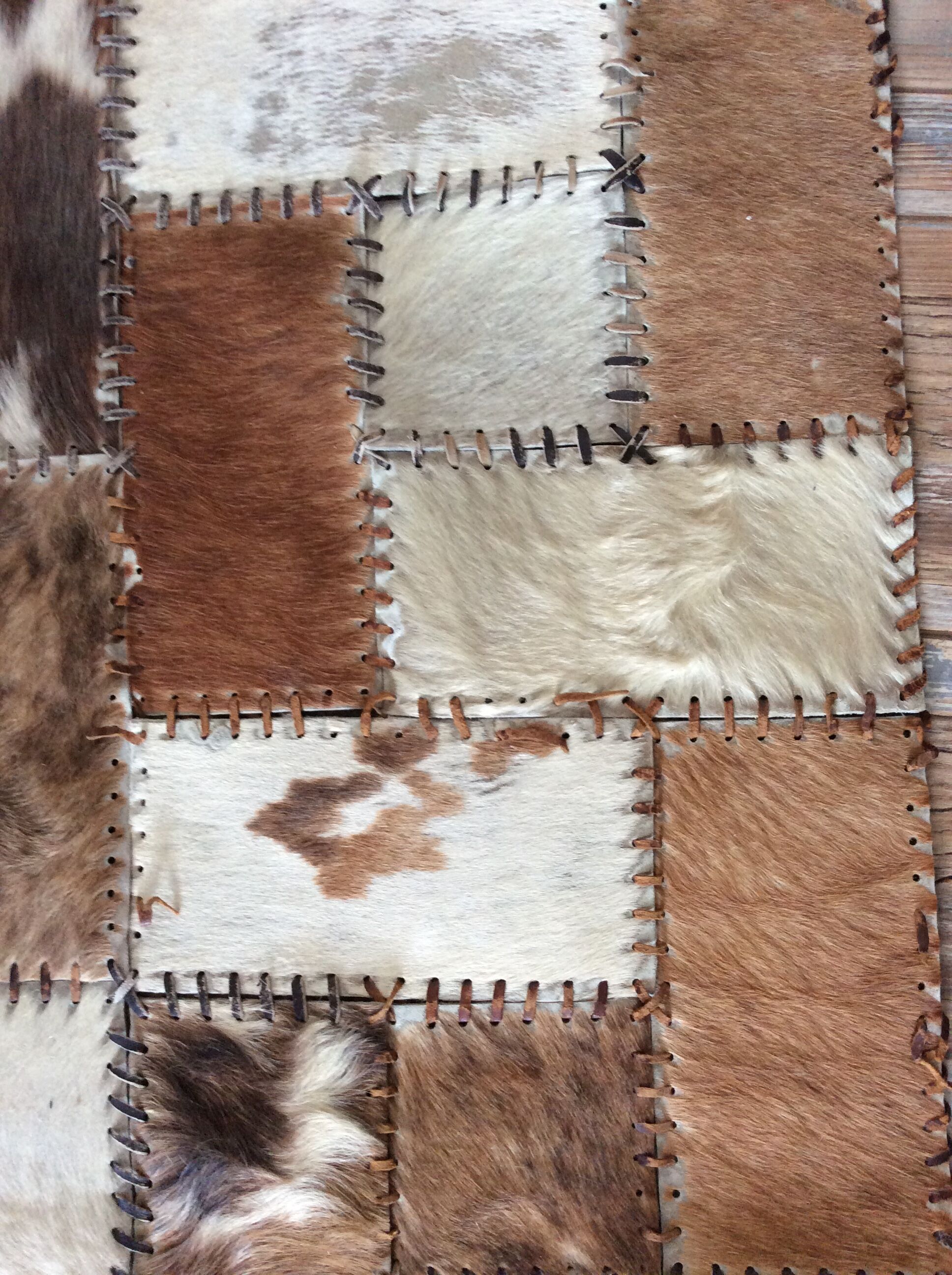 Patchwork carpet in cowhide 164x105cm from the 70s