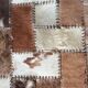 Patchwork carpet in cowhide 164x105cm from the 70s