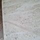 Pair of travertine nesting tables