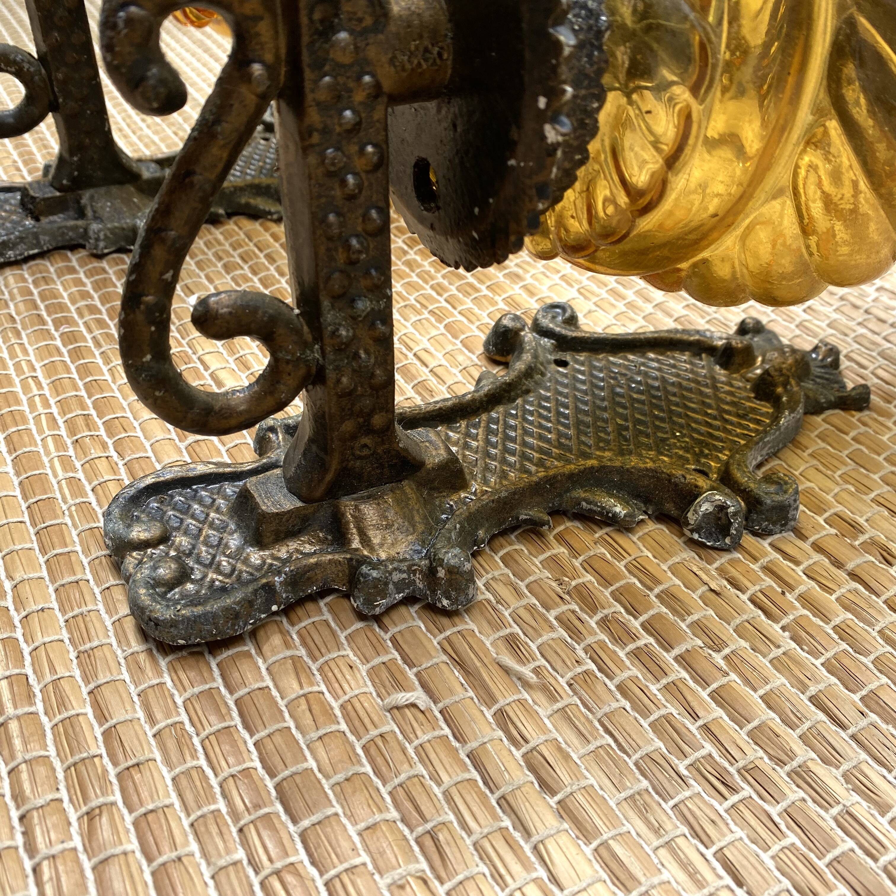 Medieval style metal and amber glass wall lamp