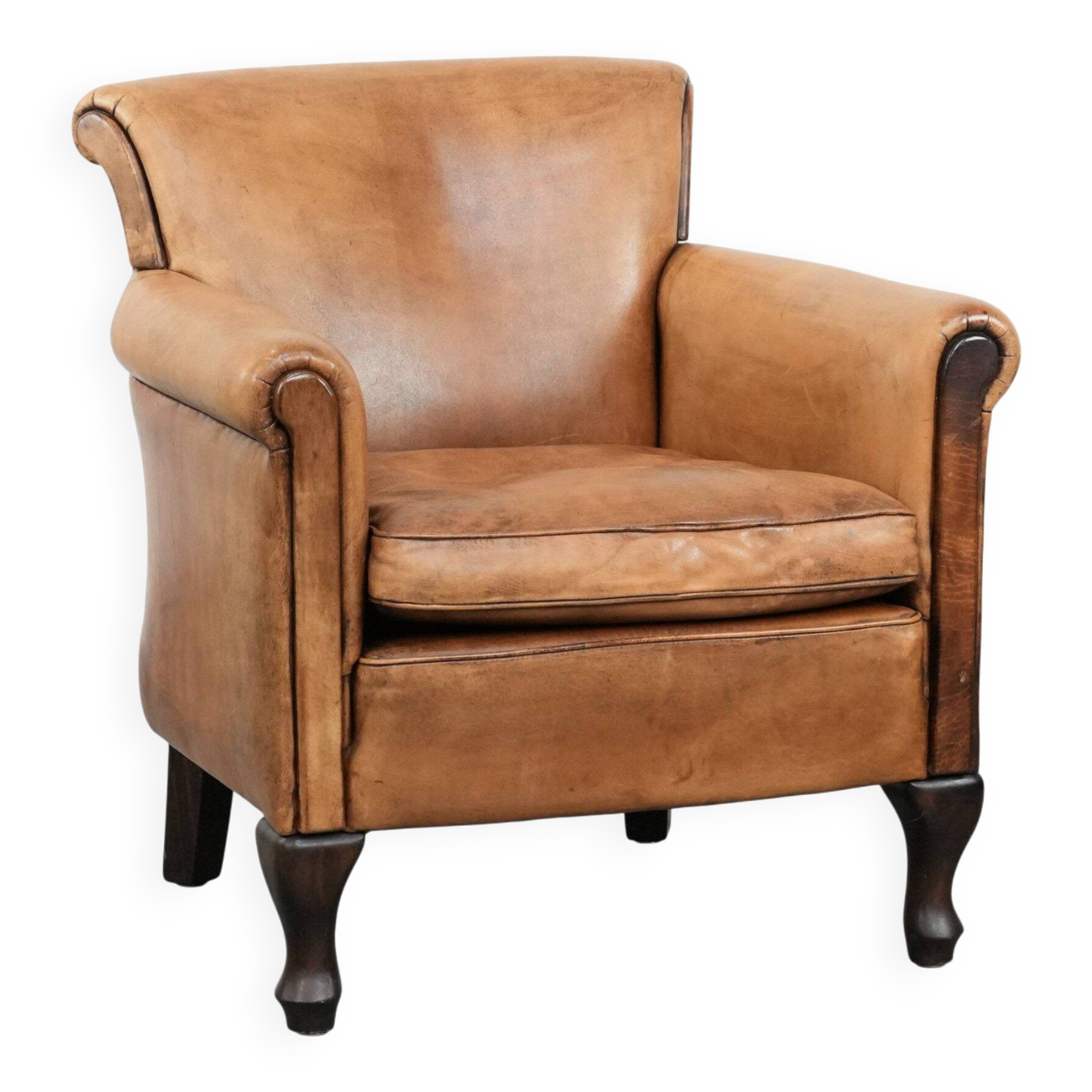 Vintage sheepskin armchair with a beautiful light colour and elegant legs