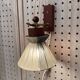 Scandinavian design wall light in teak and brass from the 1950s.