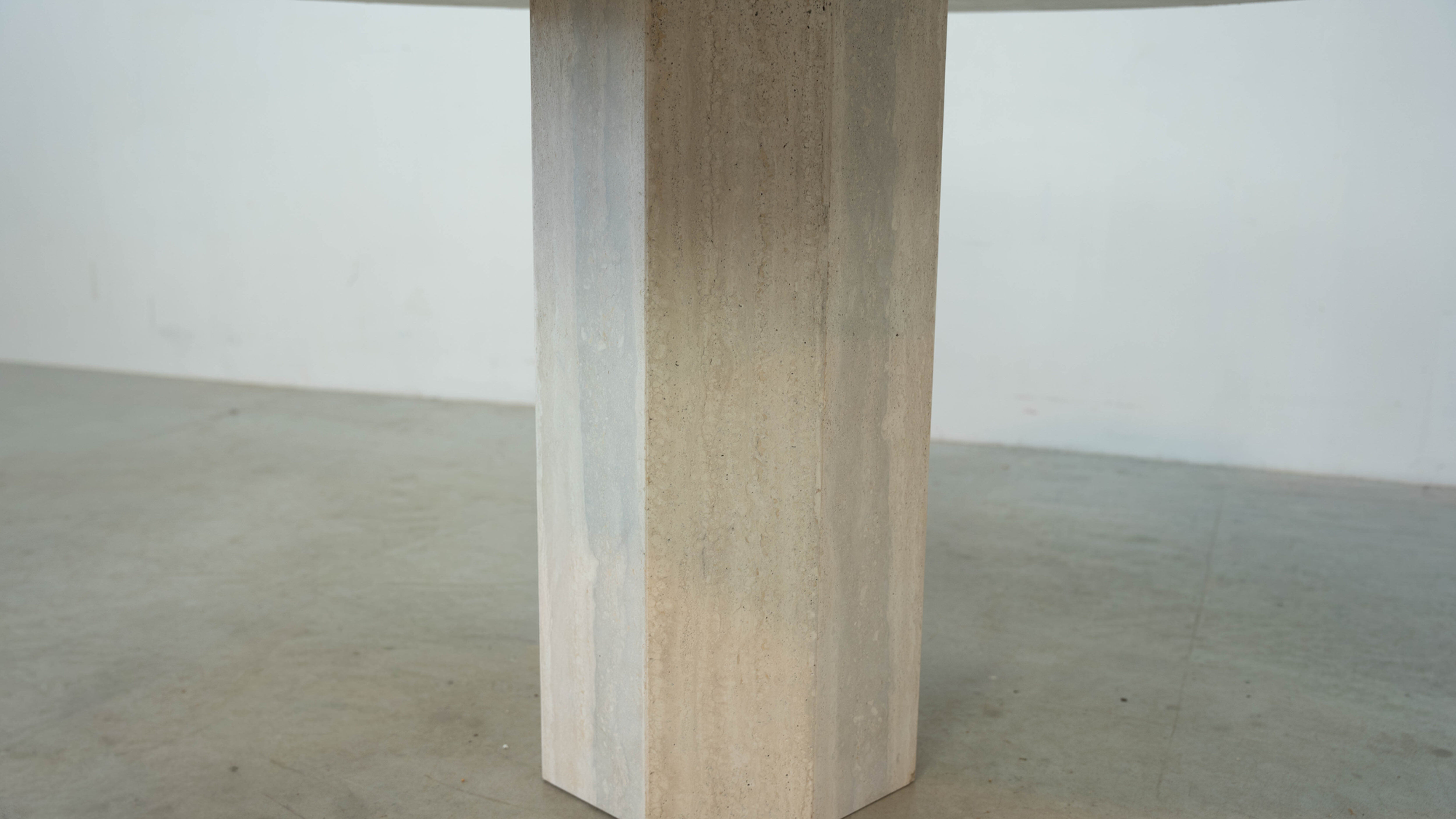 Round Belgian travertine dining table