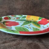Quadrifoglio dish. Italian. Fruit and flower decoration. Shimmering colors.