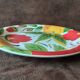 Quadrifoglio dish. Italian. Fruit and flower decoration. Shimmering colors.