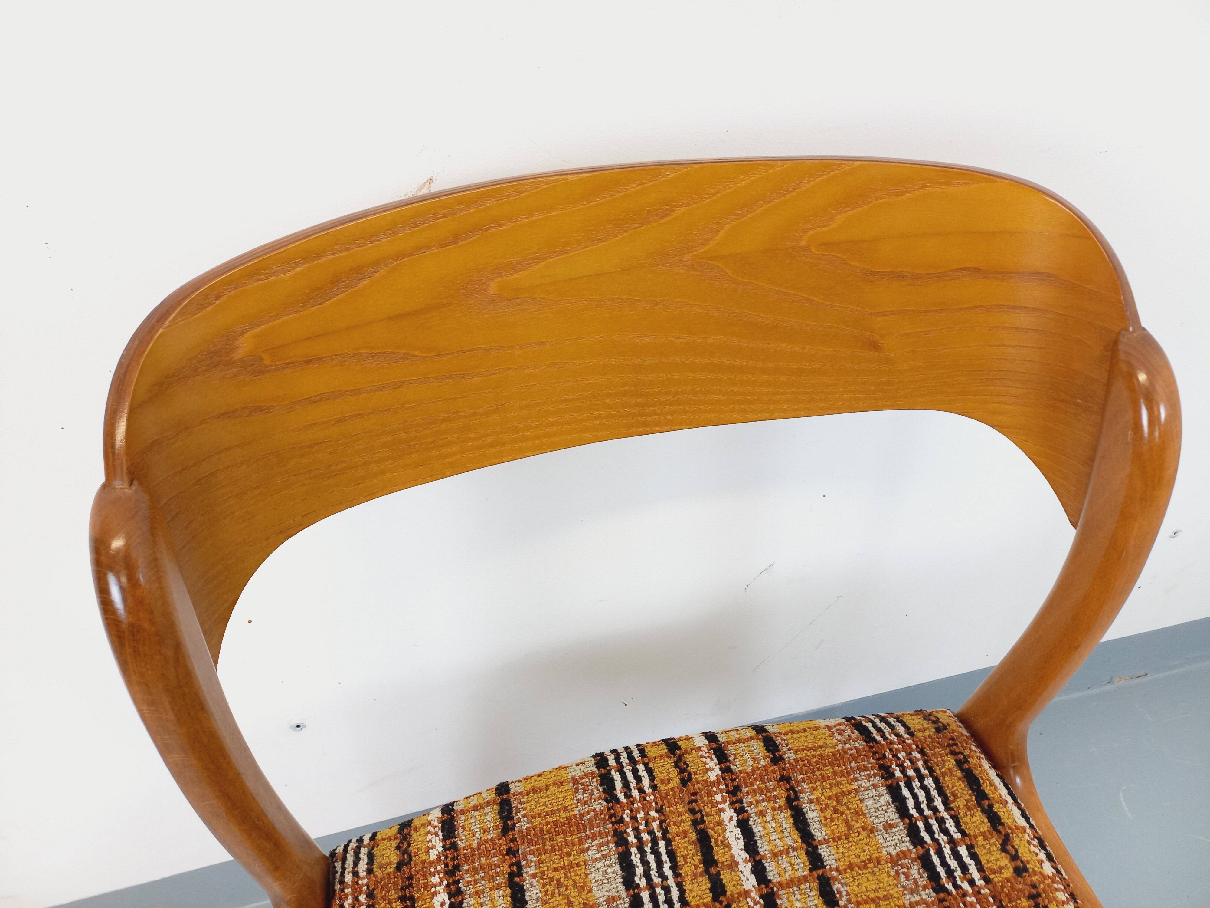 Vintage sled chair by Baumann in wood and wool fabric.