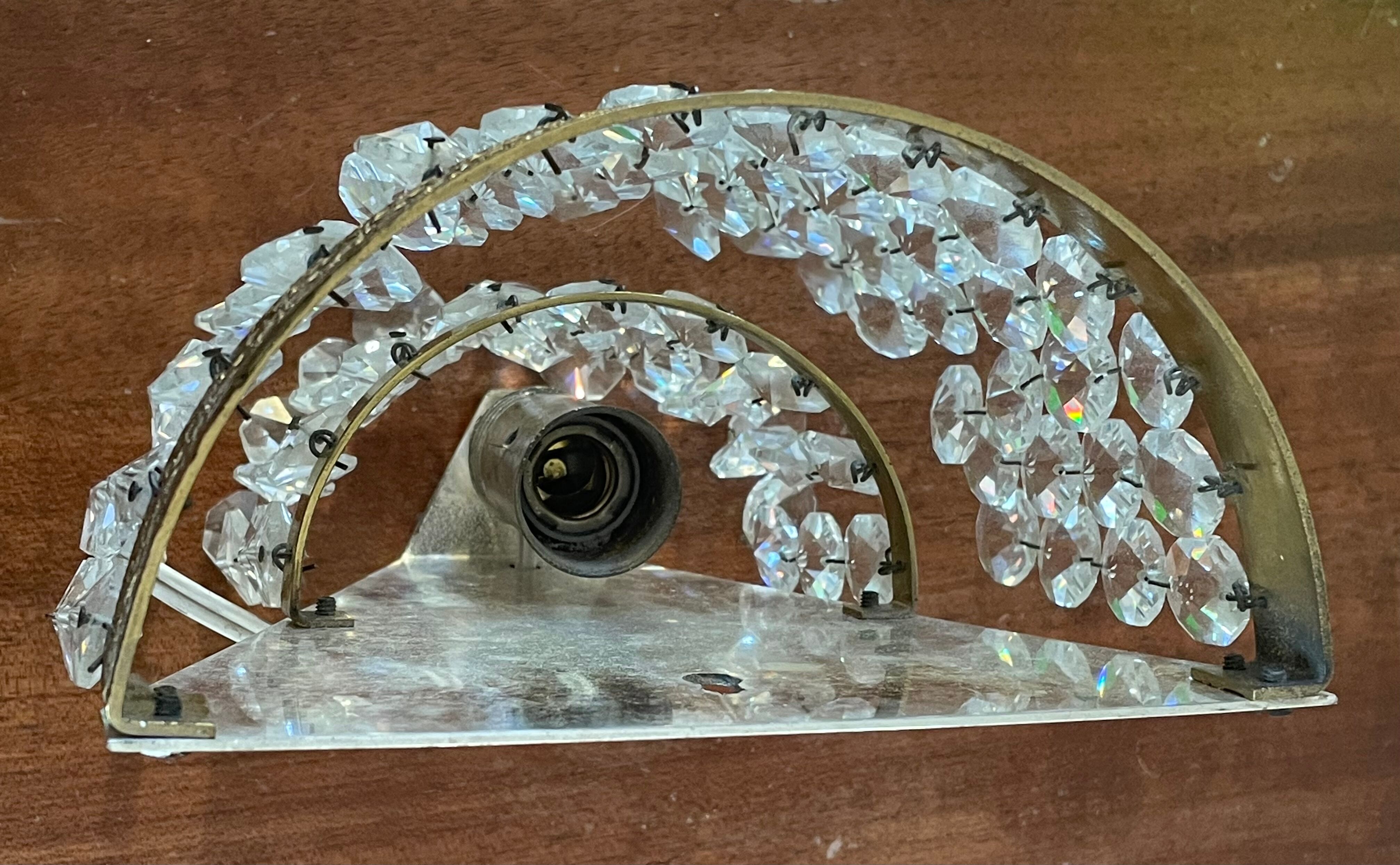 Pair of brass sconces and tassels