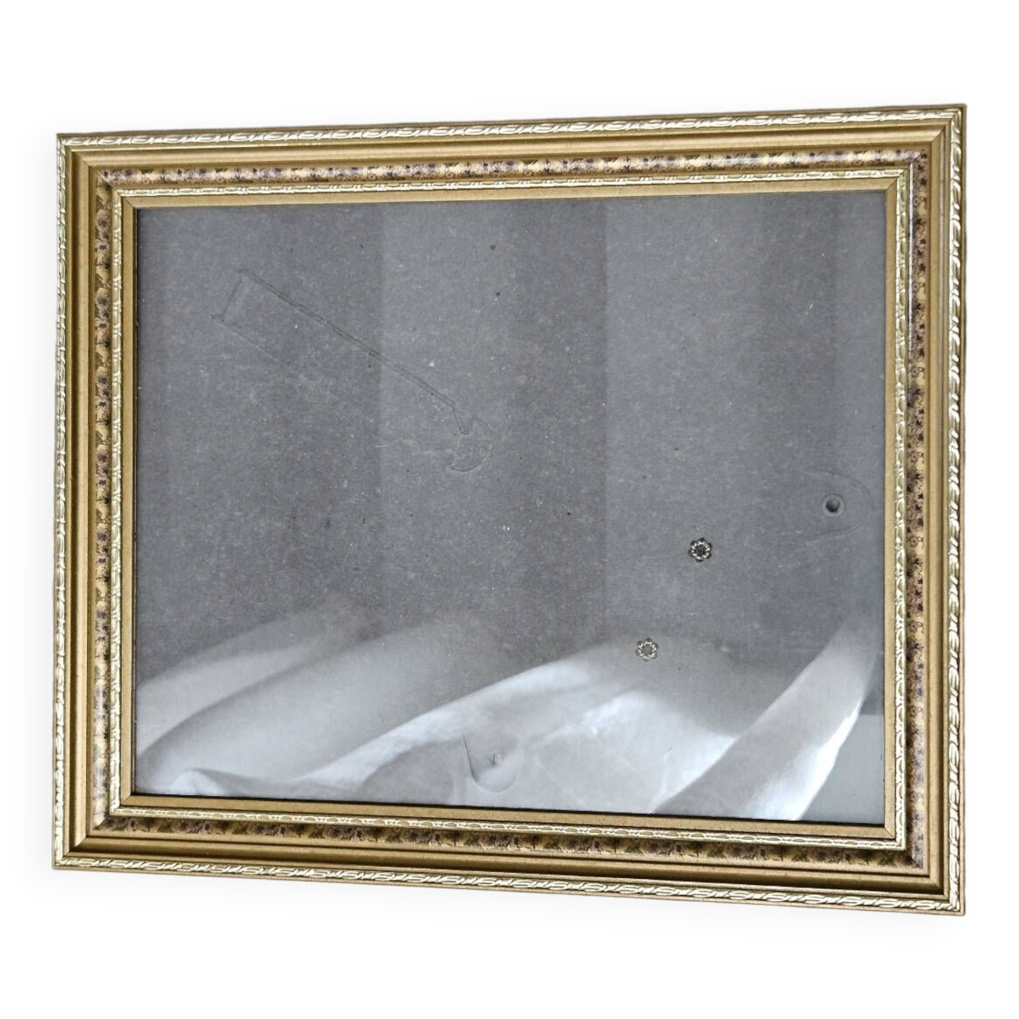 Golden wooden frame with floral patterns