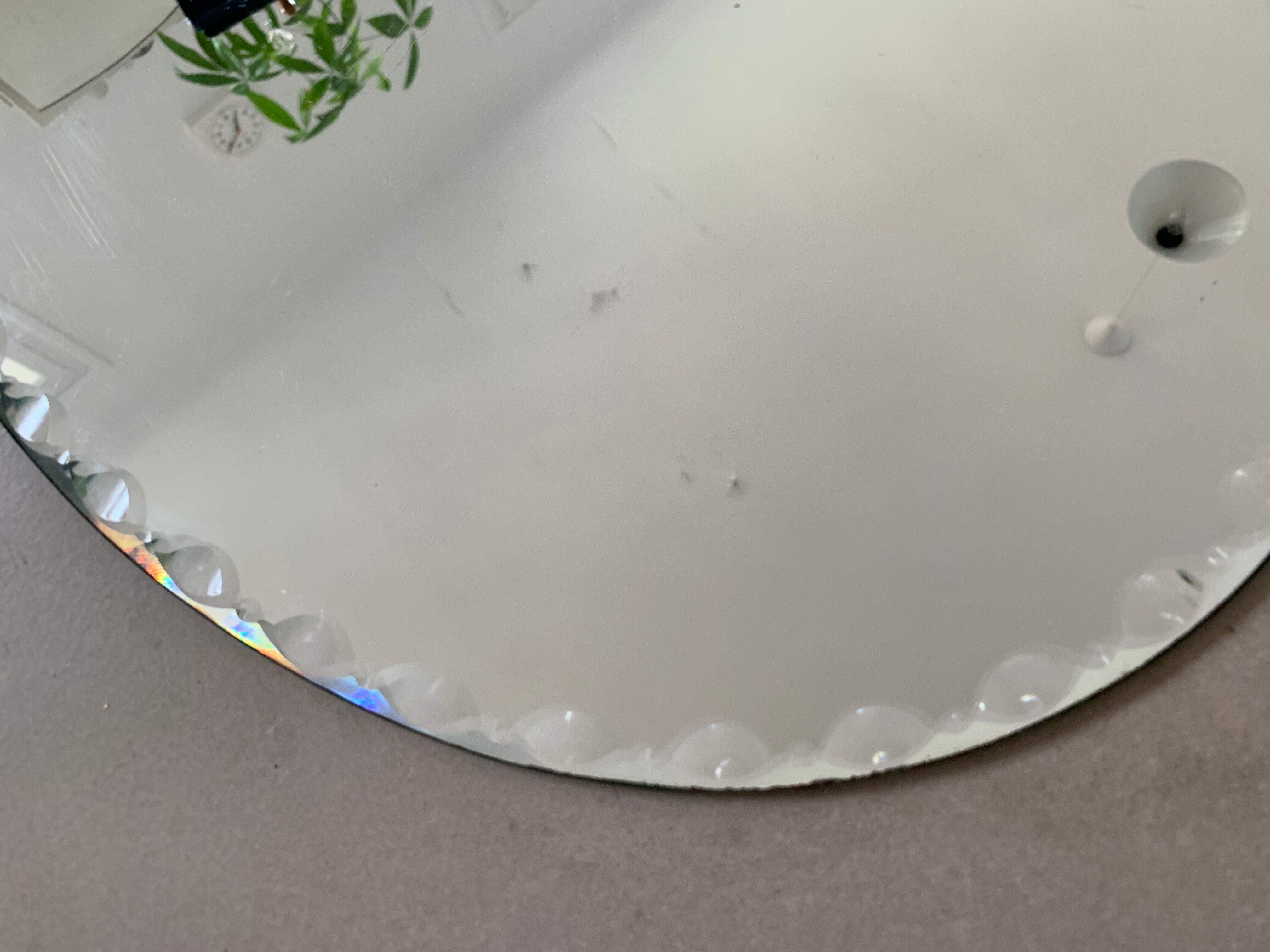 Old beveled oval mirror