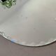 Old beveled oval mirror