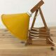 60s accordion sconce, pine, yellow metal reflector
