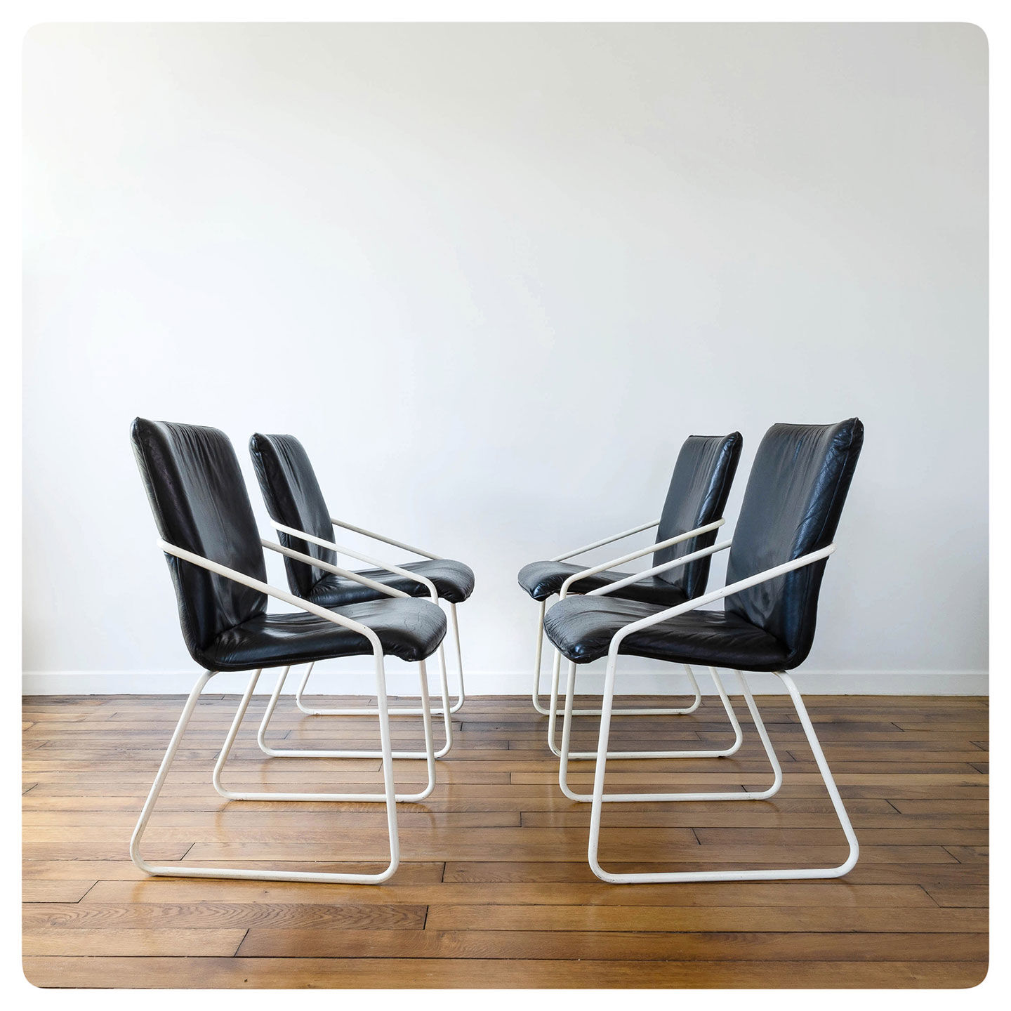 Series of 4 leather chairs, white lace-up sled
