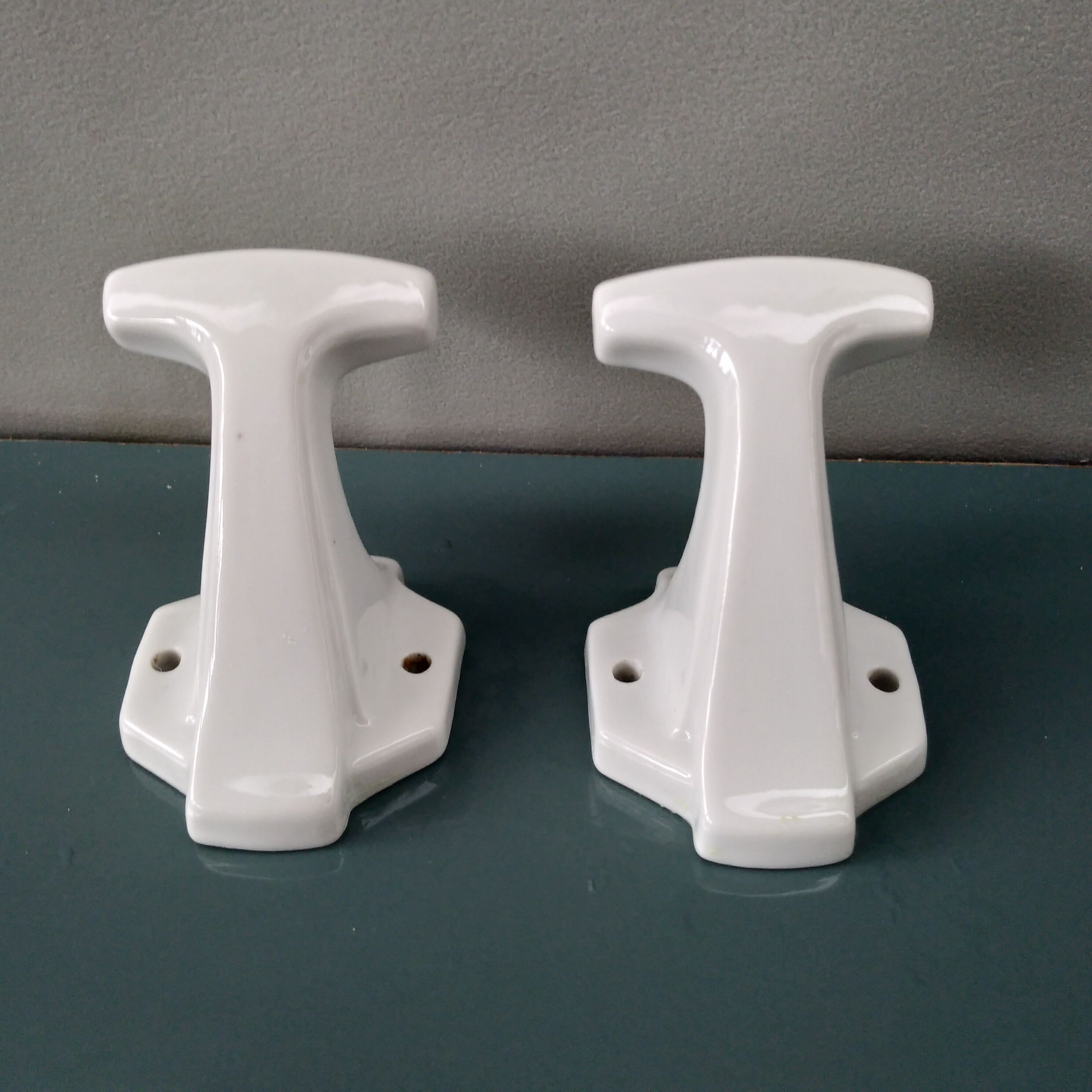 Pair of art deco porcelain coat racks