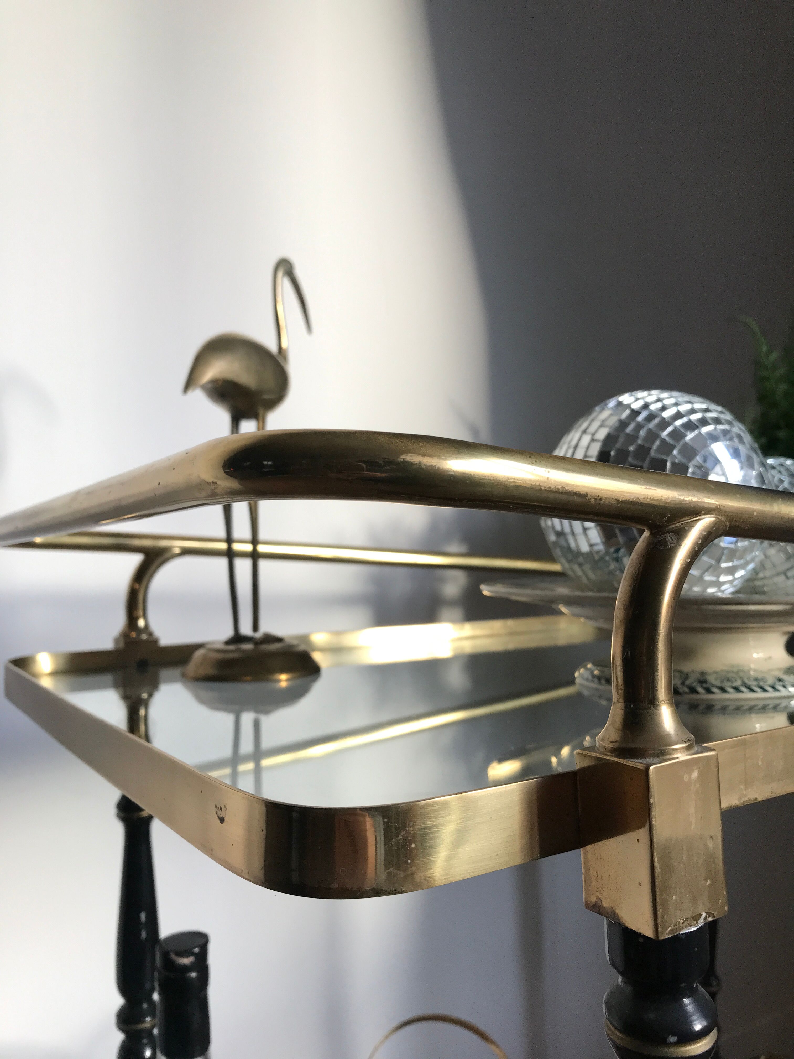 Vintage rolling golden and black dessert in brass and glass