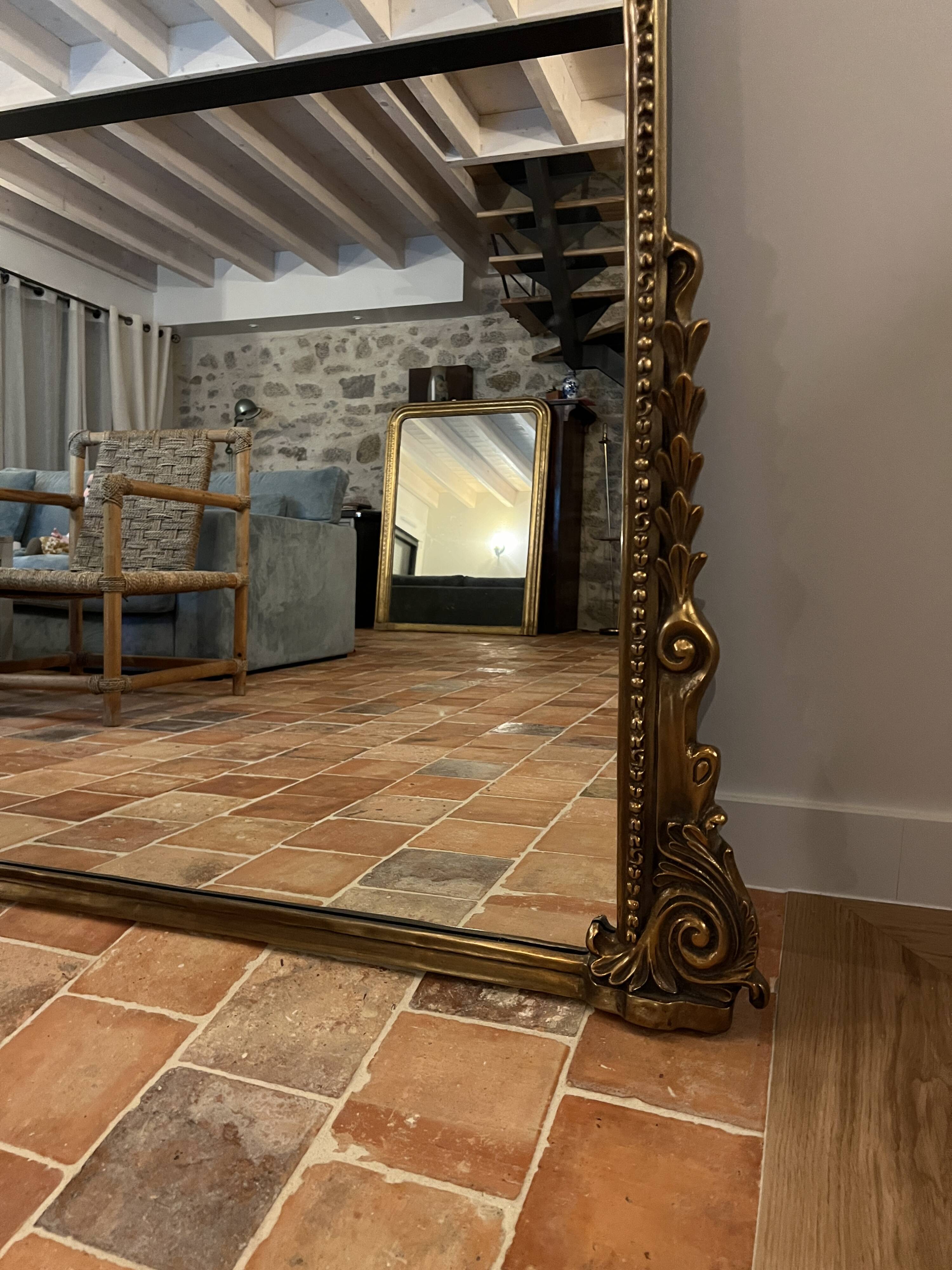 Large gilded mirror with pediment