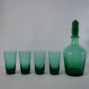 Set of a carafe and 4 designer glasses in green glass from the 70s