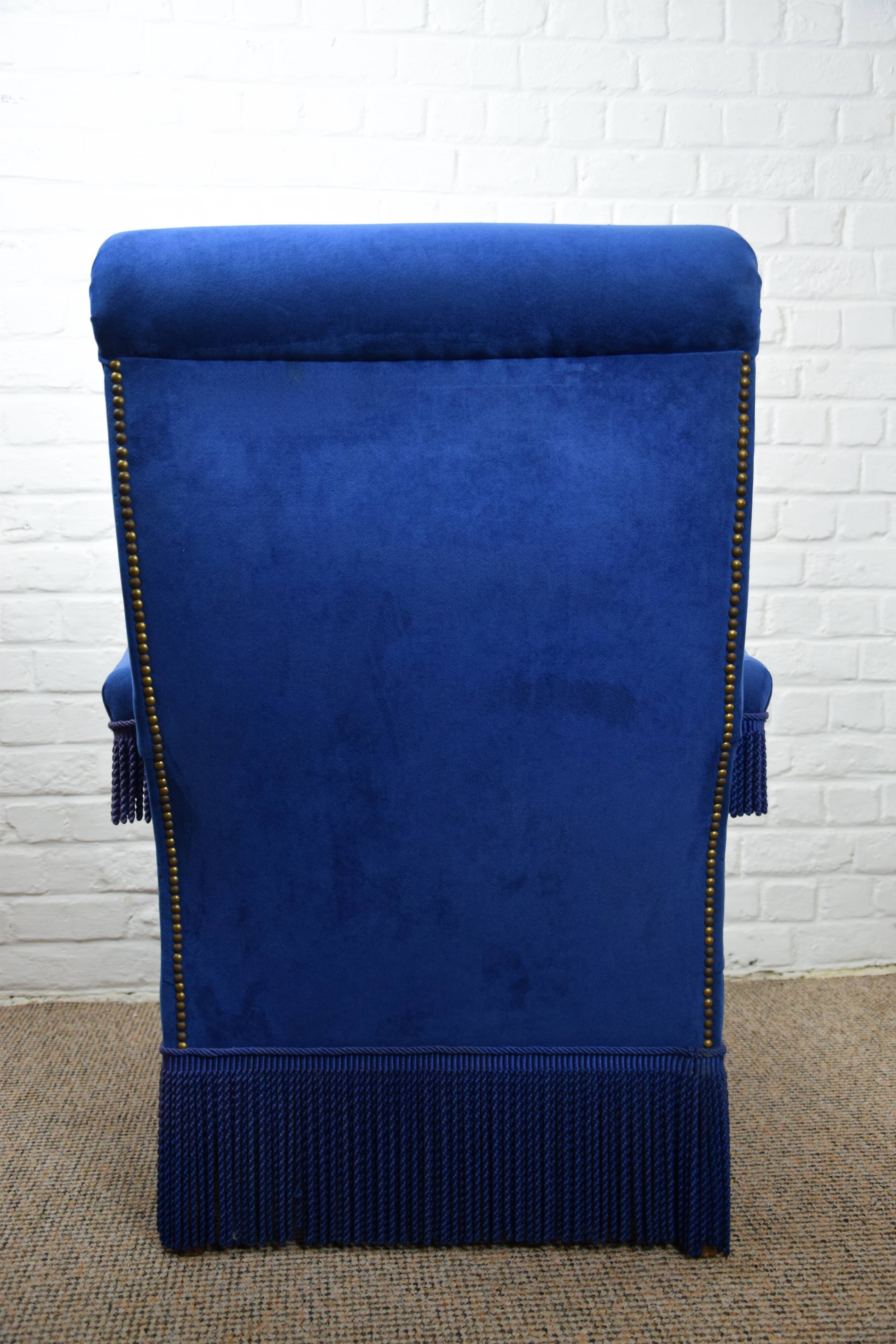 Blue velvet armchair