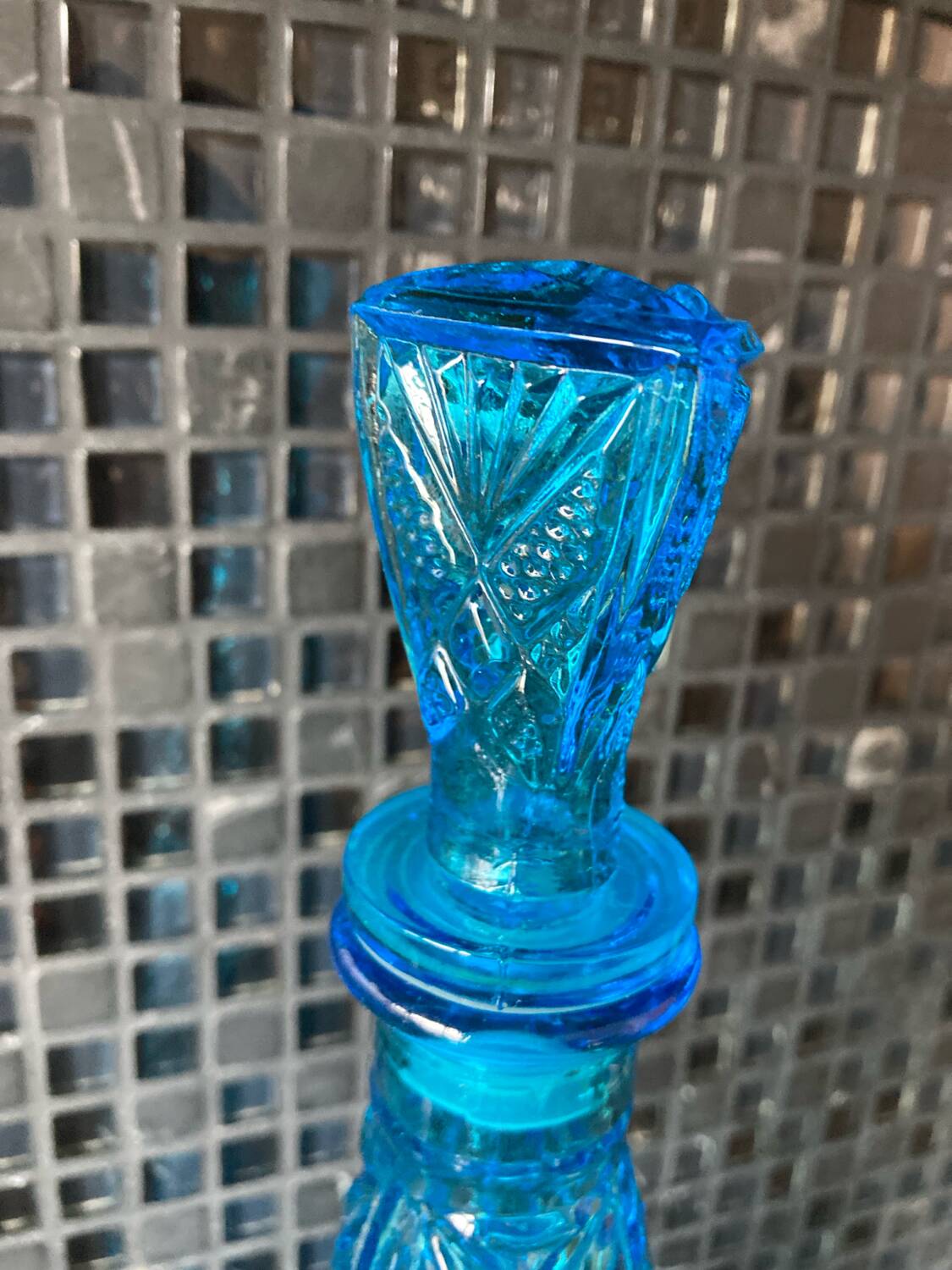 Blue chiseled glass bottle