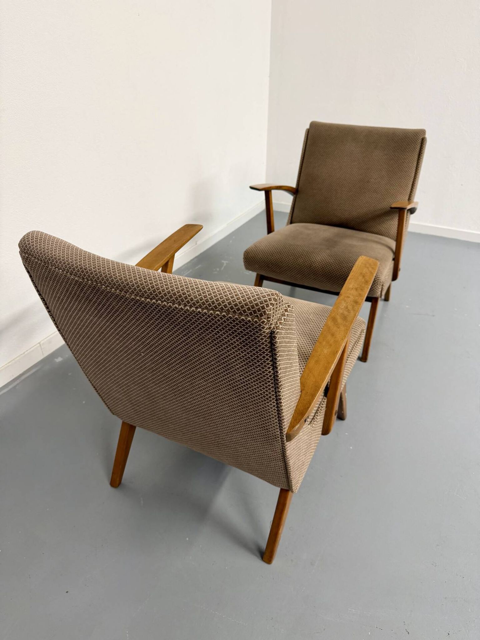 Set of 2 vintage wooden and fabric armchairs designed in the 1960s.