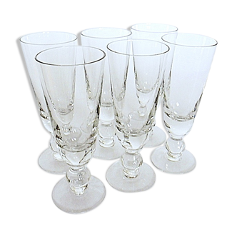 Suite of six former crystal champagne flutes