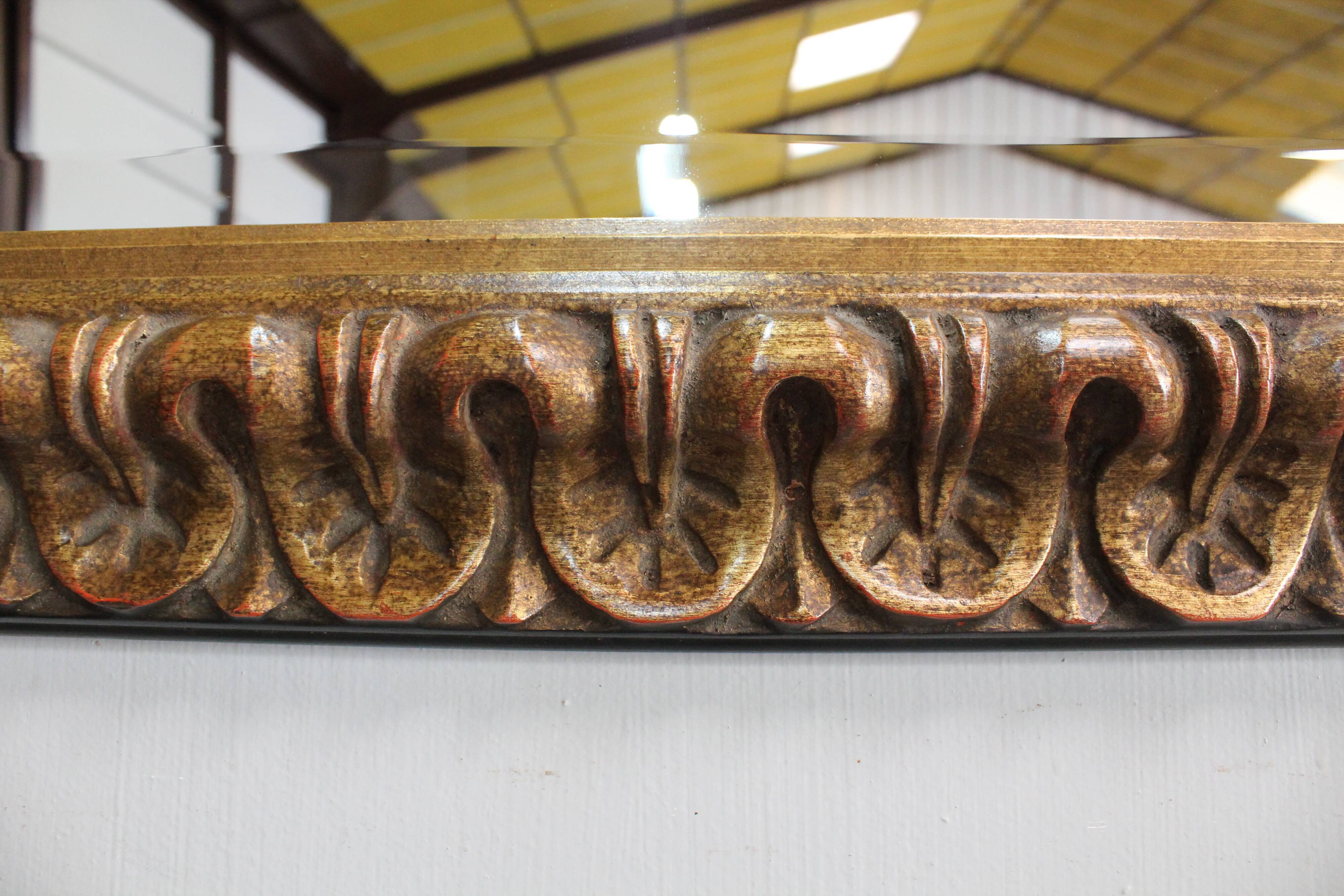 Gold-tinted wooden and stucco rectangular mirror - 1920