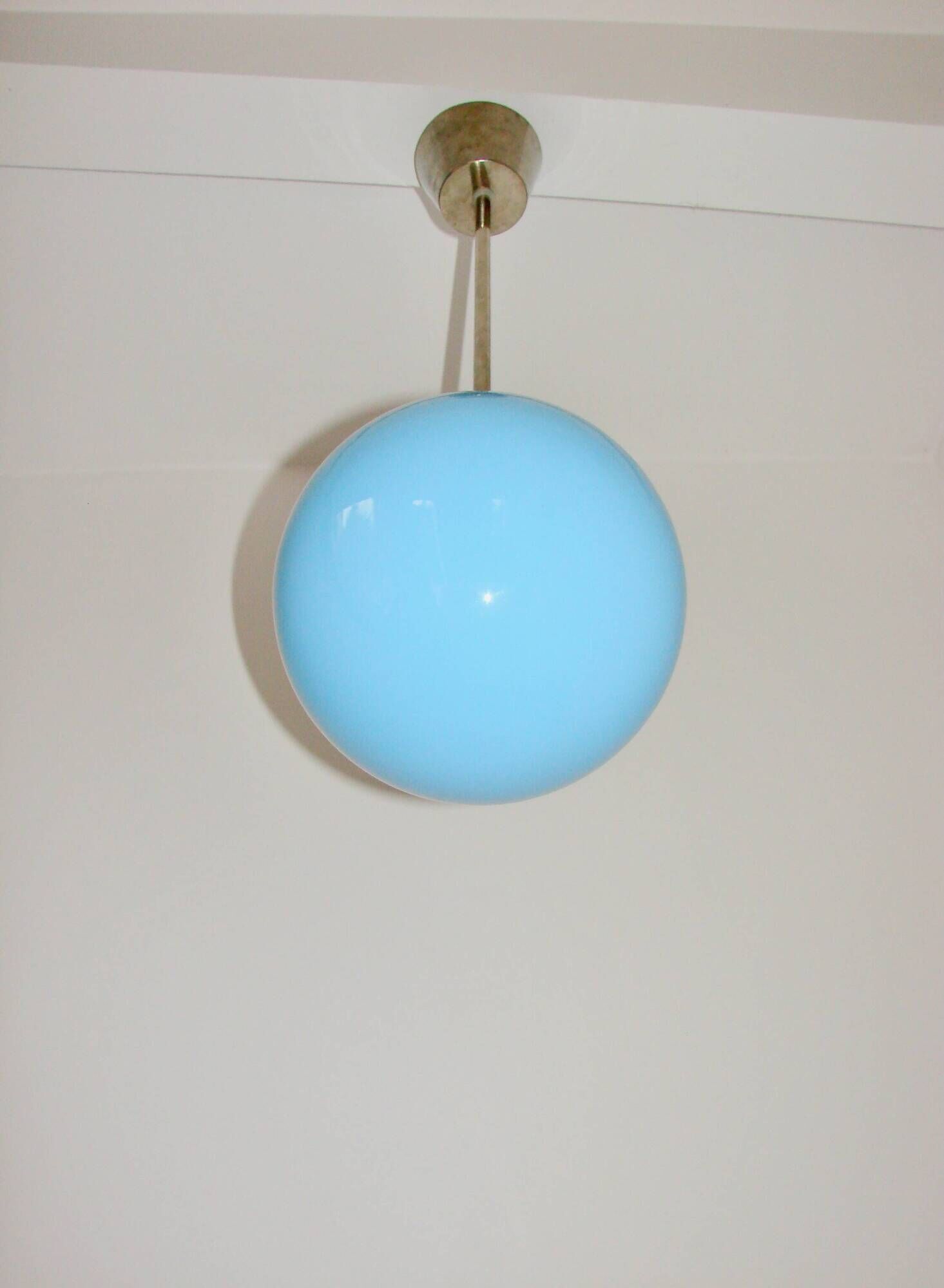 A pendant lamp with a blue glass shade, 1940s.