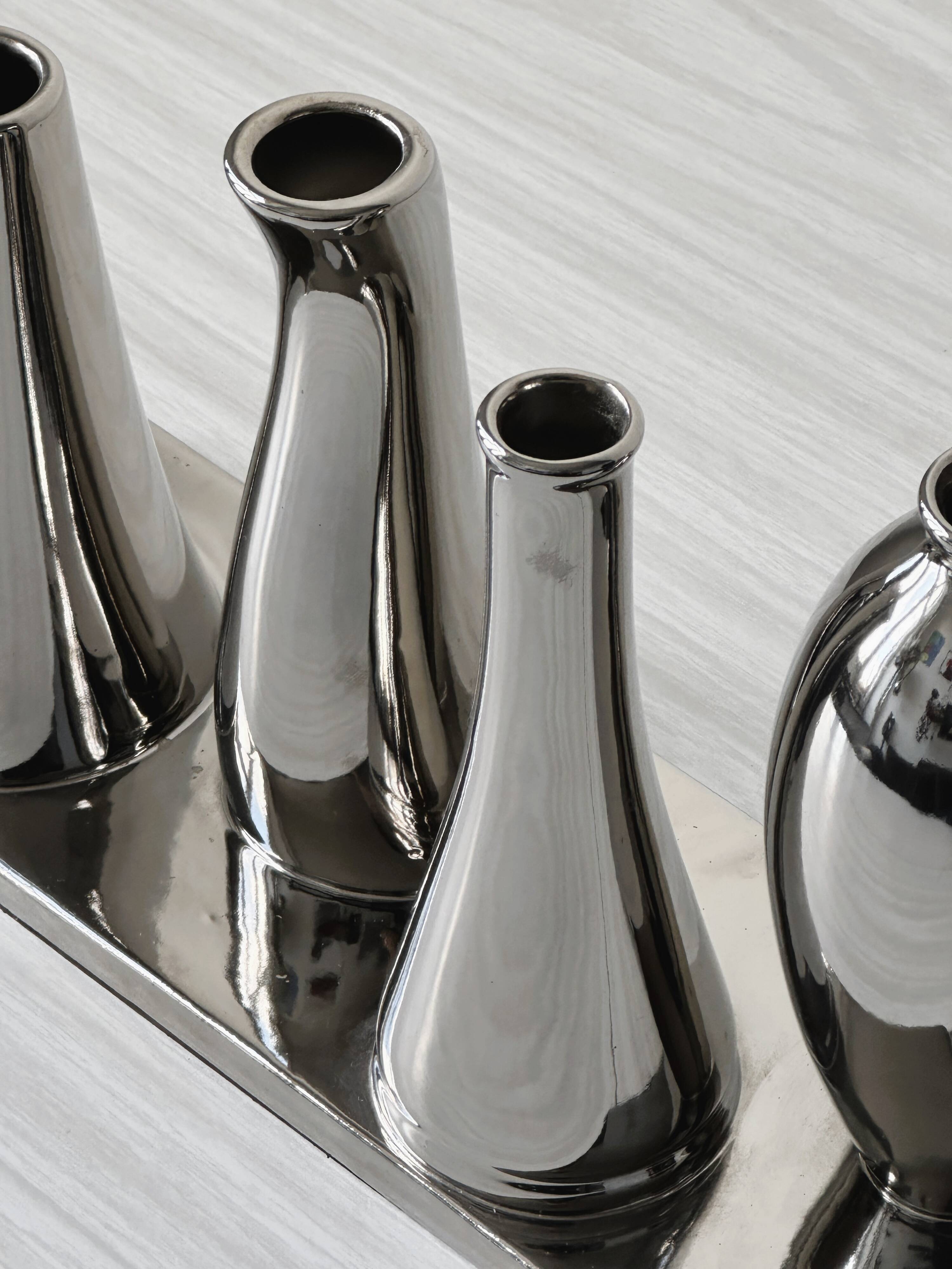 Silver soliflore vases.
