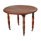 Old rustic farmhouse round table in vintage wood with folding sides