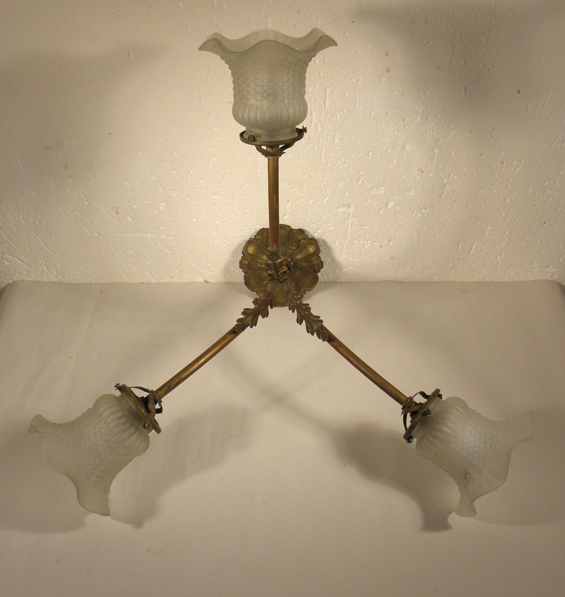 Three-spoke brass and glass chandelier