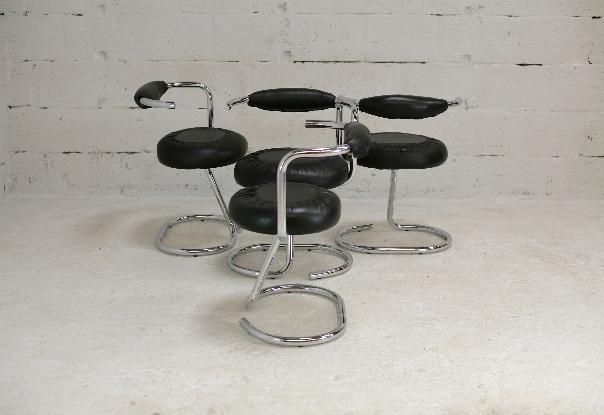 4 chairs tubular steel, imitation black leather, Italy, circa 1970