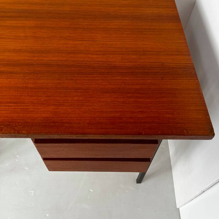 Vintage wooden and metal desk in modernist style.