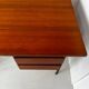Vintage wooden and metal desk in modernist style.