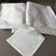 White embroidered organdie tablecloth and 12 assorted towels